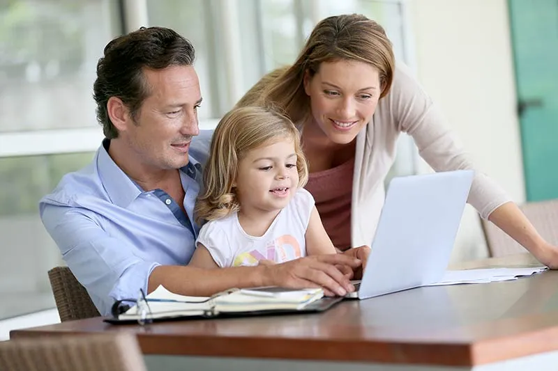 Illustrative photograph of a family using a computer together