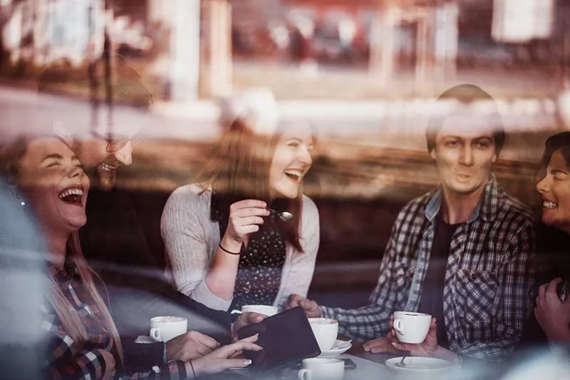 Illustrative photograph of a conversation over coffee
