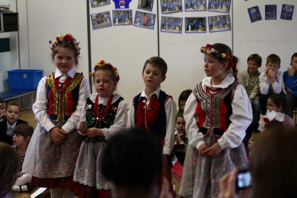 Archive photograph of children in Polish folk costume during Independence Day